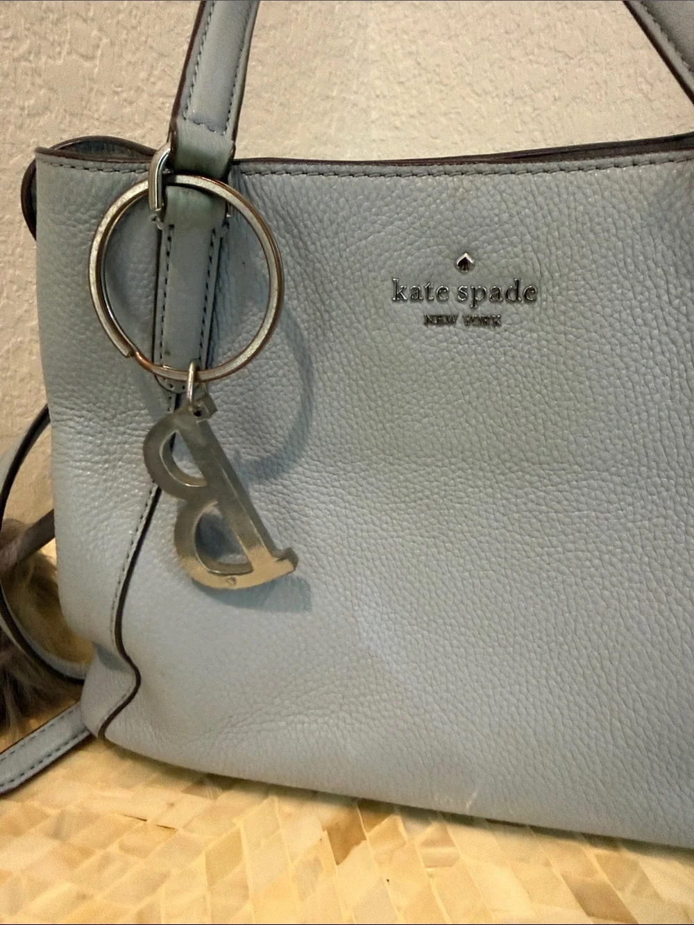 Kate Spade pale blue pebbled leather satchel with charm
